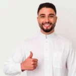 young arab man wearing typical arab clothes isolated white background smiling raising thumb up min 1